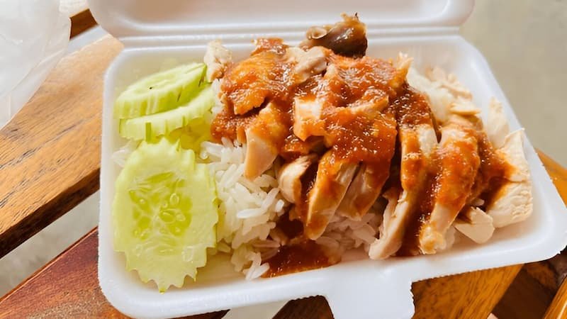 Chicken rice plate during the best time to visit Singapore for street food in March.