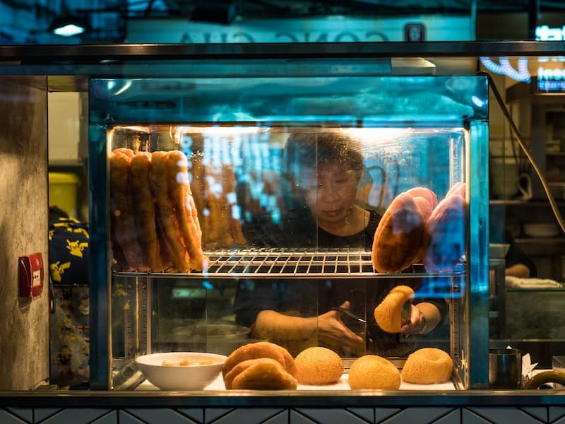 Street vendor preparing banh mi in Hanoi