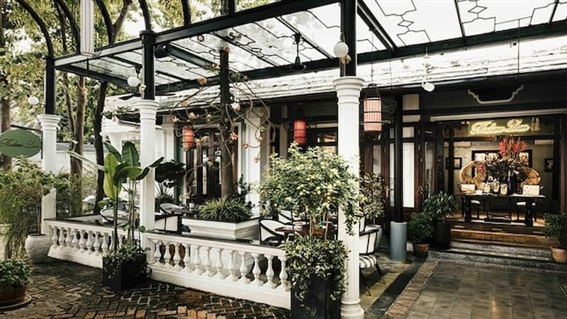 Hidden garden seating area at Vejo vegetarian restaurant in Hanoi's Tay Ho district