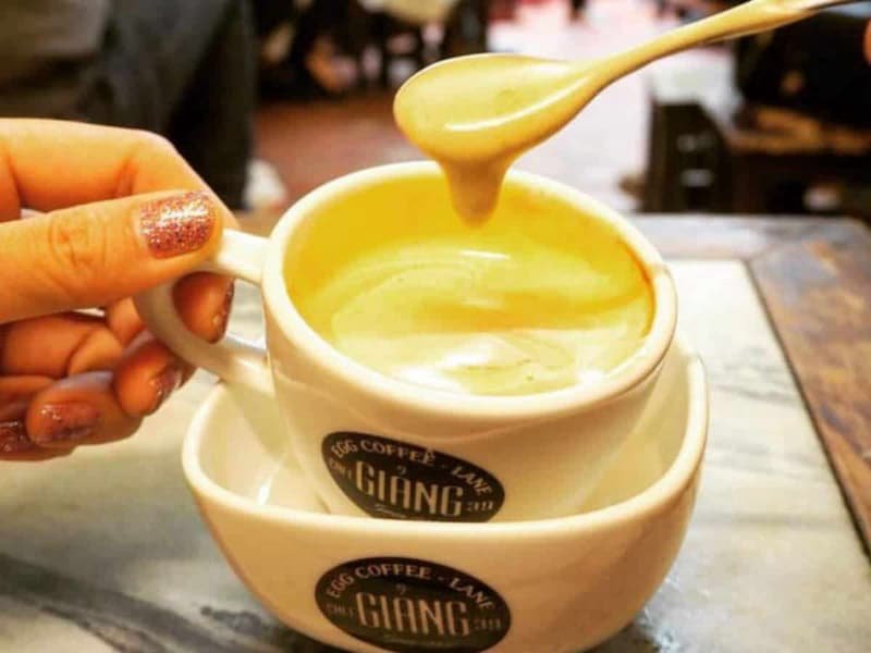 Traditional egg coffee from Café Giảng in Hanoi with Vietnamese coffee filter