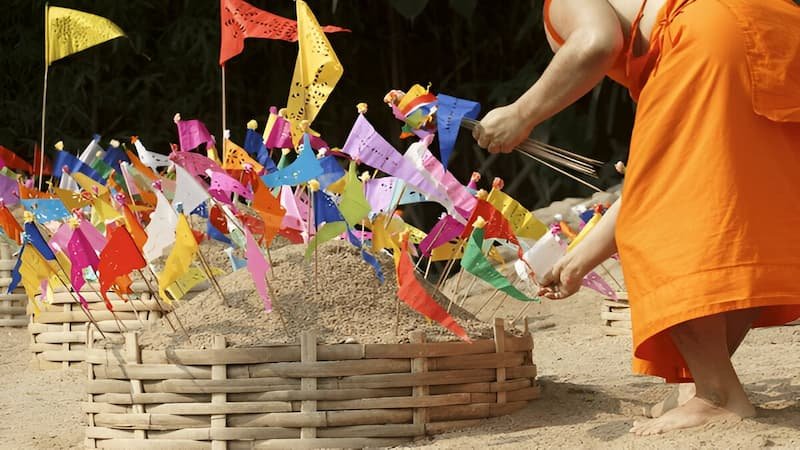 Locals building sand chedis at Wat Pho, Bangkok