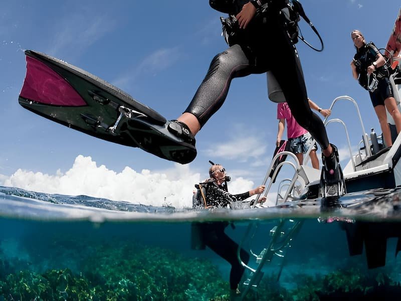 Half-underwater photo showing beginner scuba diving Philippines destination at Malapascua Island