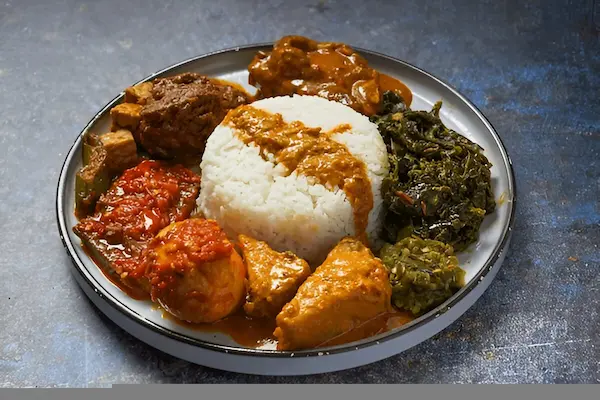 Nasi Padang - Traditional West Sumatran feast with multiple dishes including rendang, curry, and vegetables