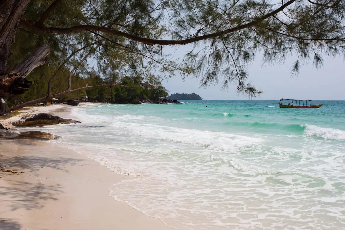 Secluded white sand beach on Koh Rong with crystal clear waters and virtually no crowds, offering budget travelers a premium beach experience without the premium prices of Thailand's increasingly overcrowded islands