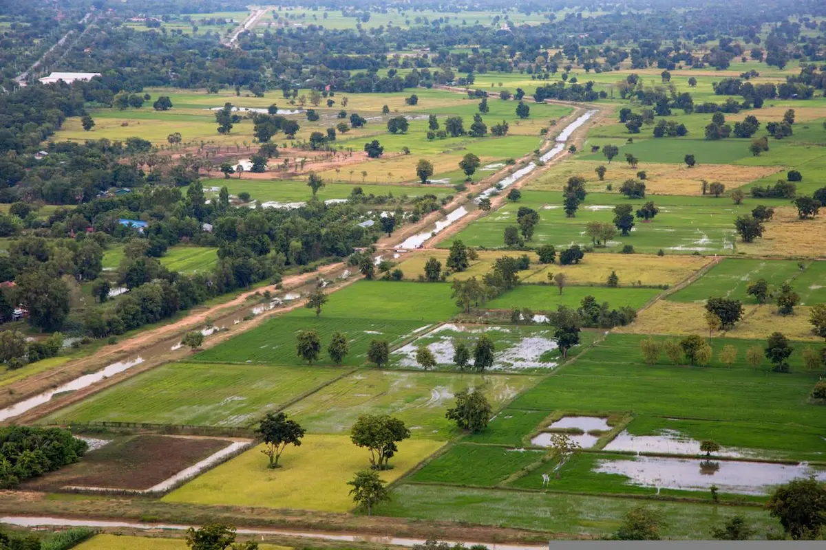 Scenic rural countryside surrounding Battambang that budget travelers can explore by bicycle for just $1-2 per day rental, offering authentic Cambodian experiences at minimal cost