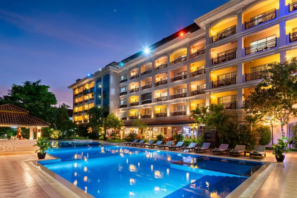 Elegant budget hotel in Phnom Penh with marble lobby, spacious rooms, and skyline view from the rooftop bar