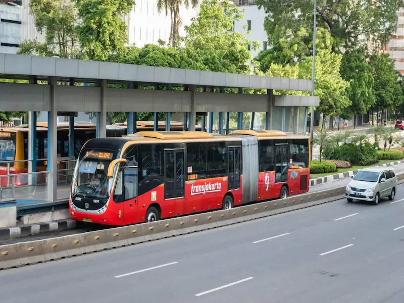 TransJakarta bus rapid transit system with dedicated lanes and modern buses