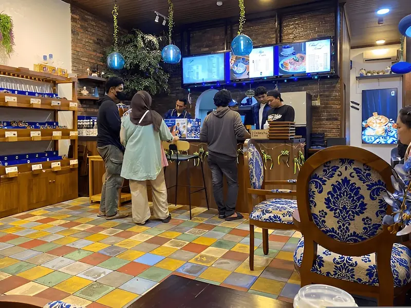 Traditional Jakarta coffee shop (warkop) serving kopi tubruk and local specialties