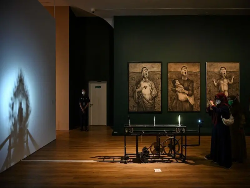 Contemporary art exhibition at Museum MACAN in Jakarta with visitors engaging with installations