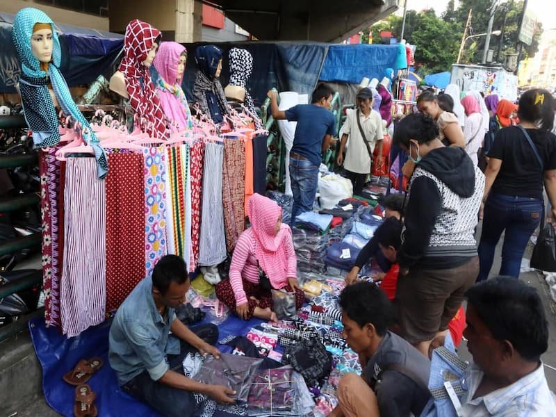 Colorful textile displays at Tanah Abang, Southeast Asia's largest textile market in Jakarta