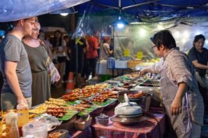Bustling Bangkok street food market with Pad Thai stall