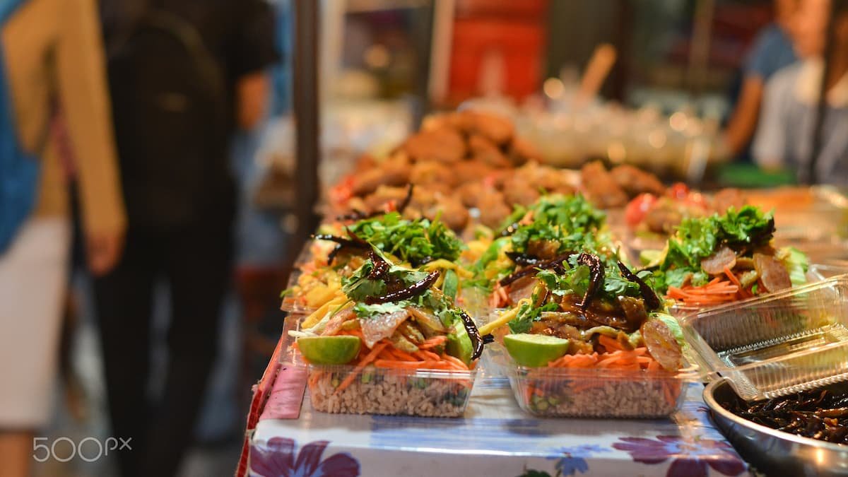 Vibrant Hanoi street food scene with Vietnamese dishes