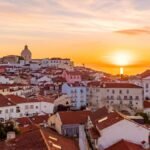 Lisbon skyline at sunset, one of the Best Cities in Portugal for Digital Nomads.