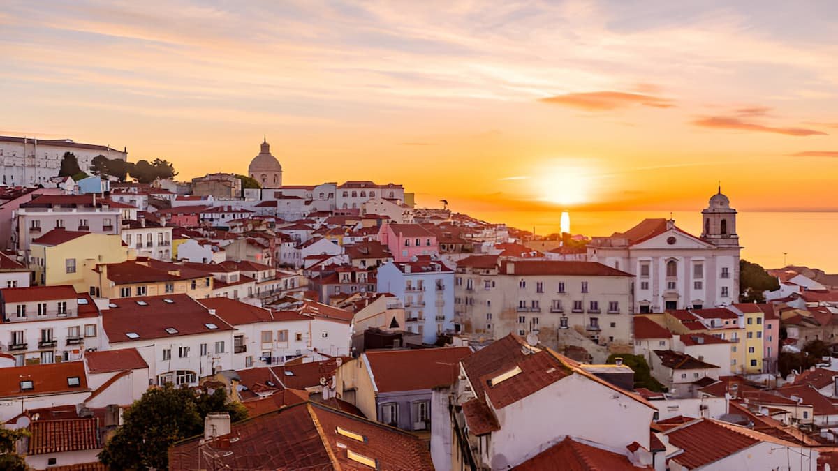 Lisbon skyline at sunset, one of the Best Cities in Portugal for Digital Nomads.