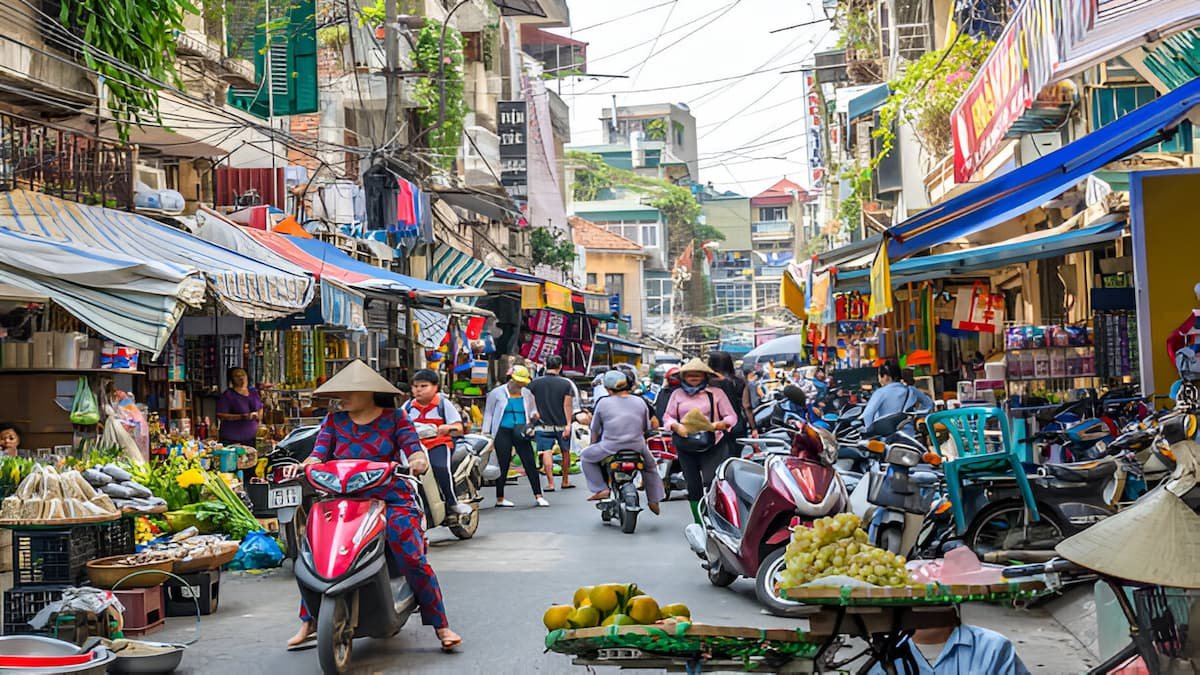 Bustling street food scene in Hanoi's Old Quarter with vegetarian food stalls